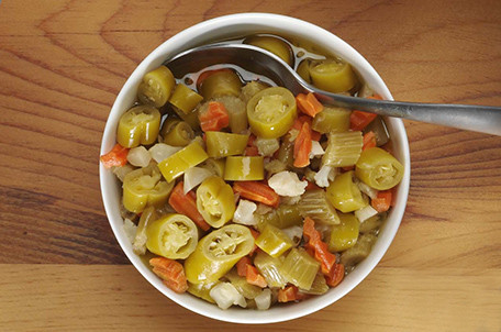 A bowl filled with a colorful assortment of food, showcasing a variety of textures and ingredients.