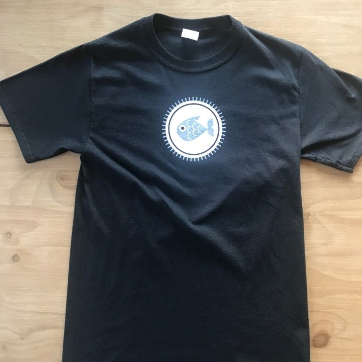 A black t - shirt with a circle on it 1