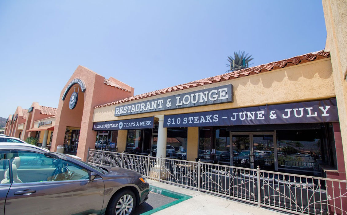 A car parked in front of the restaurant