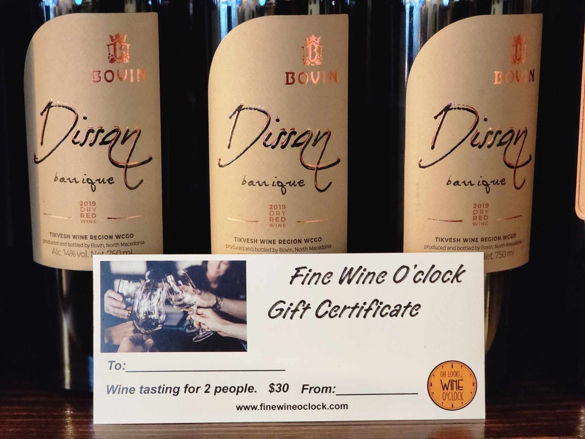 a group of wine bottles with a gift certificate