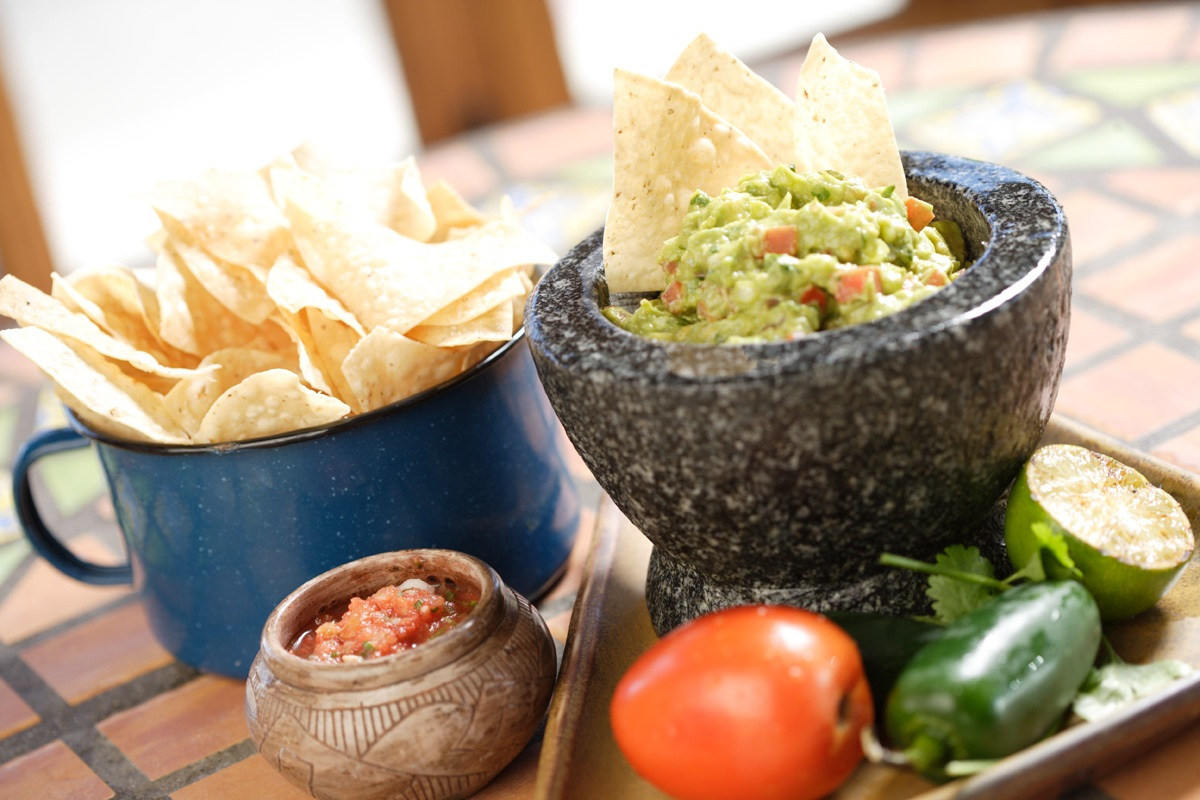 Guacamole dip served with tortilla chips 