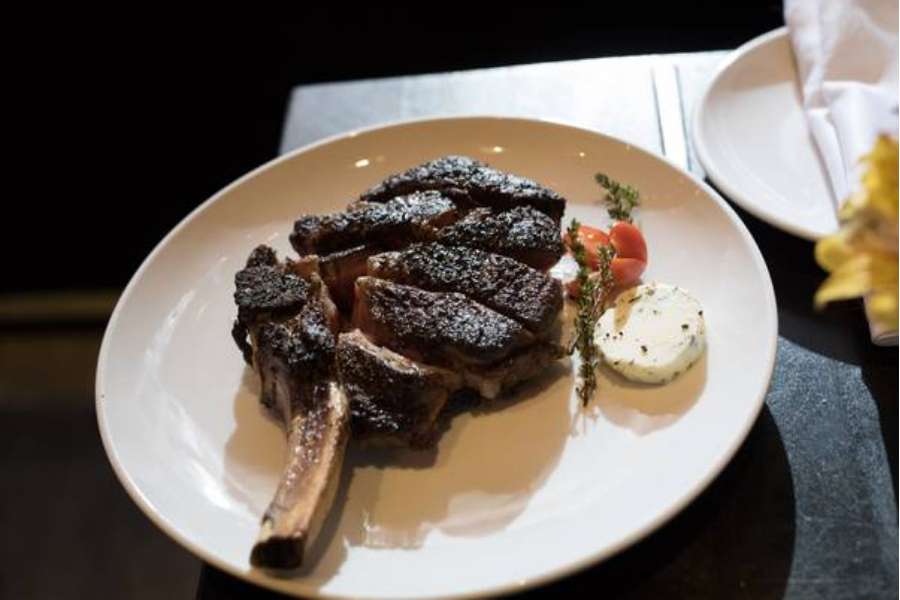 Steak served on a plate.
