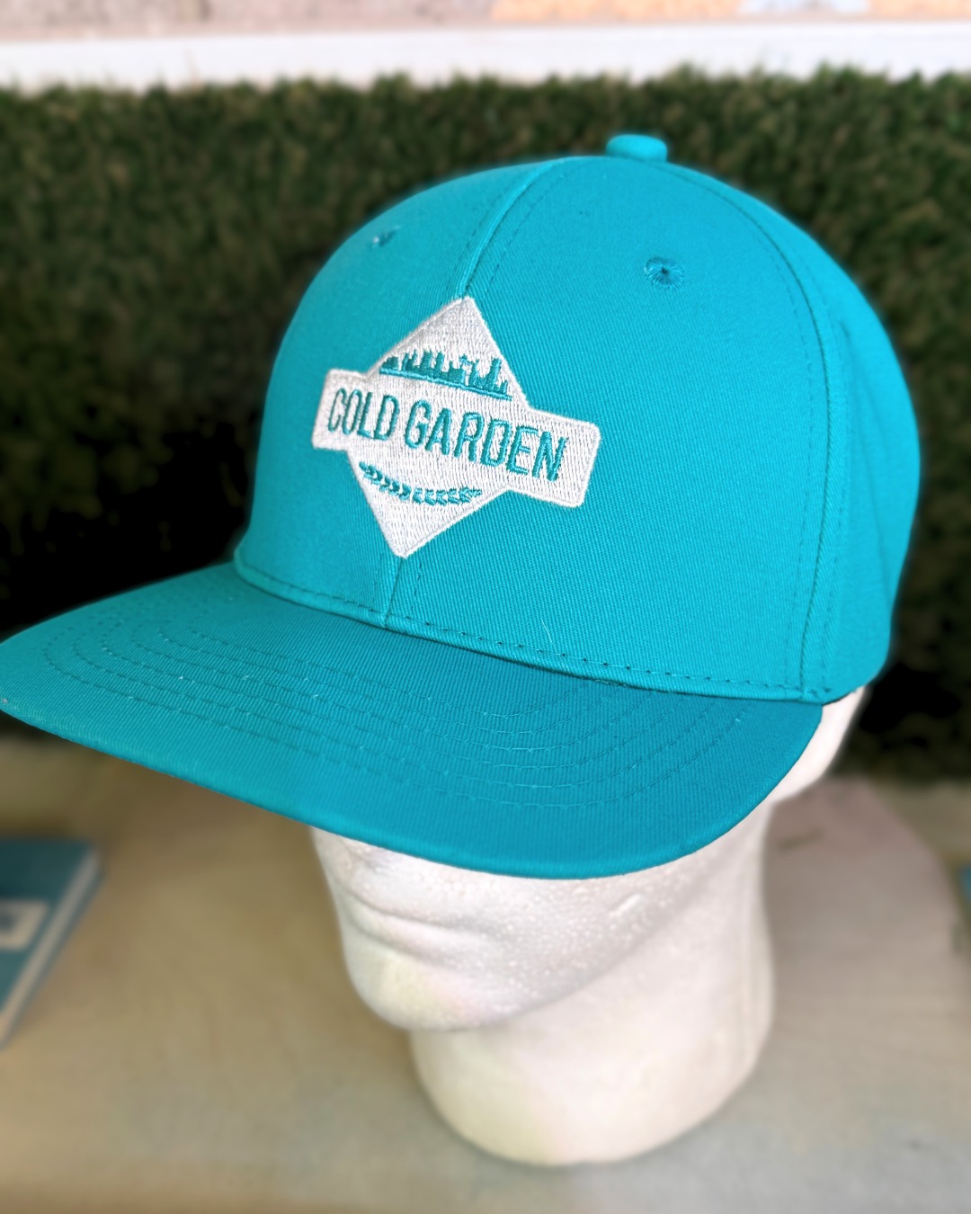 teal snapback