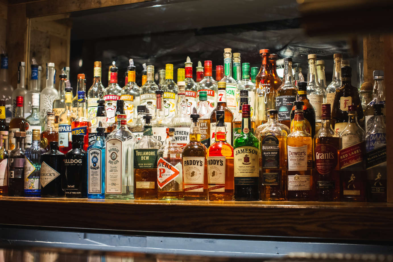Liquor bottles on bar shelf