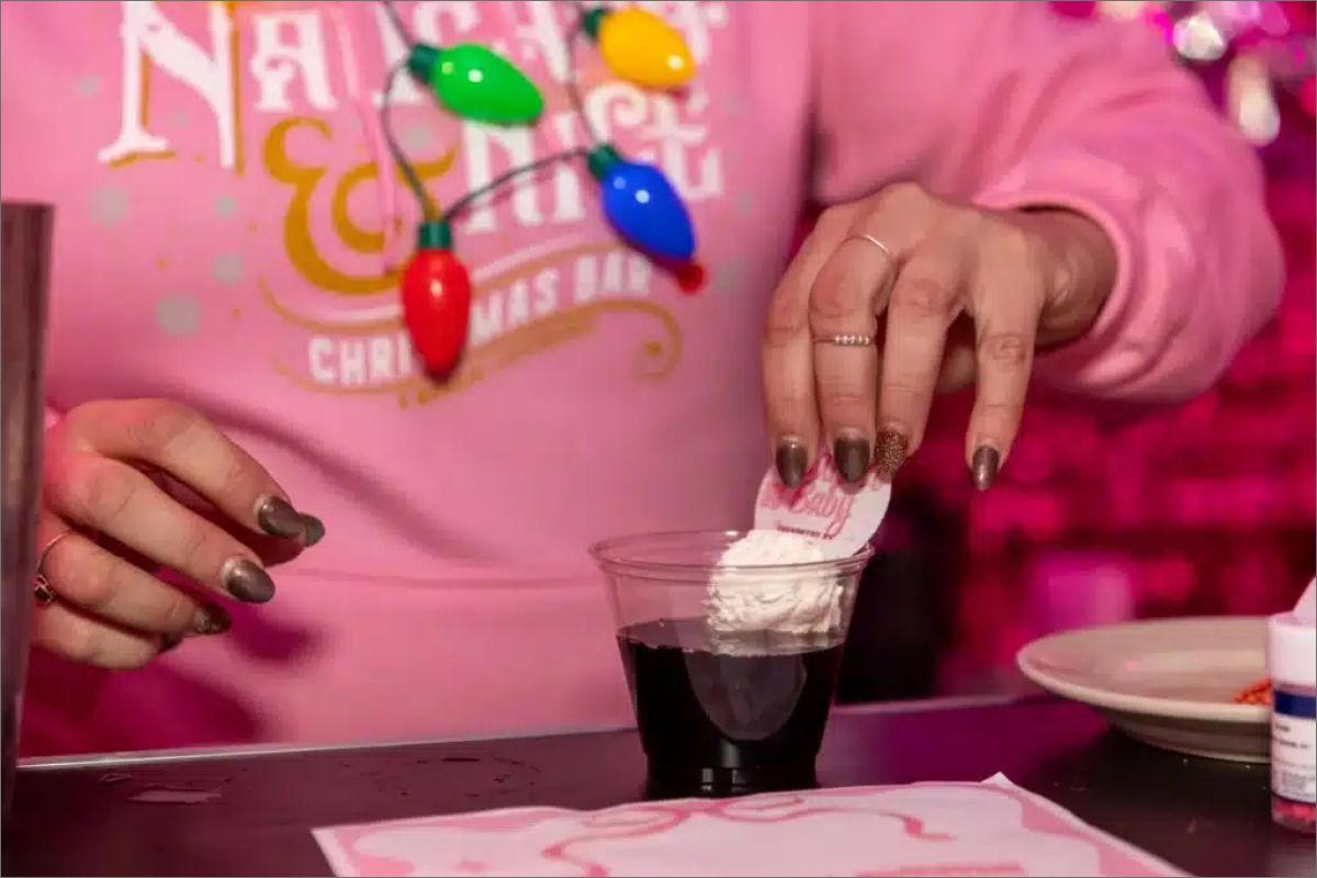 Festive cocktail being garnished