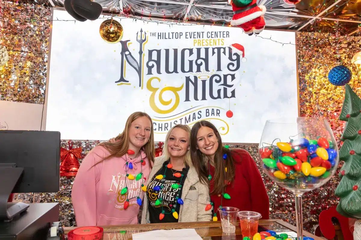 Naughty and Nice team members at the Christmas bar