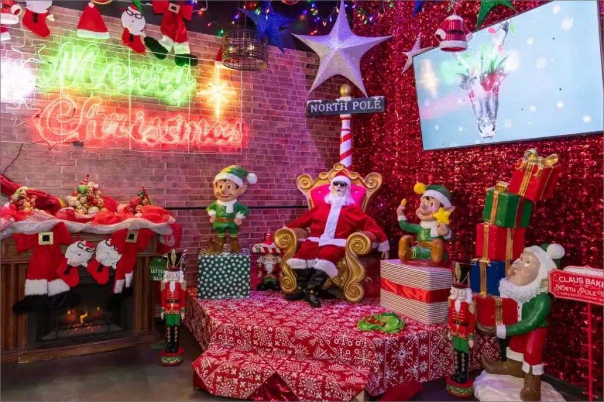 Christmas themed room with Santa, elves and holiday decorations