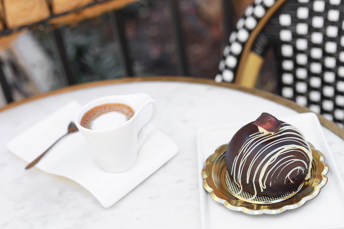 Chocolate brownie bomb dessert served with a cup of espresso