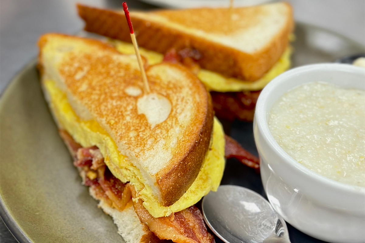Breakfast Sandwich served with scrambled eggs, bacon and American cheese