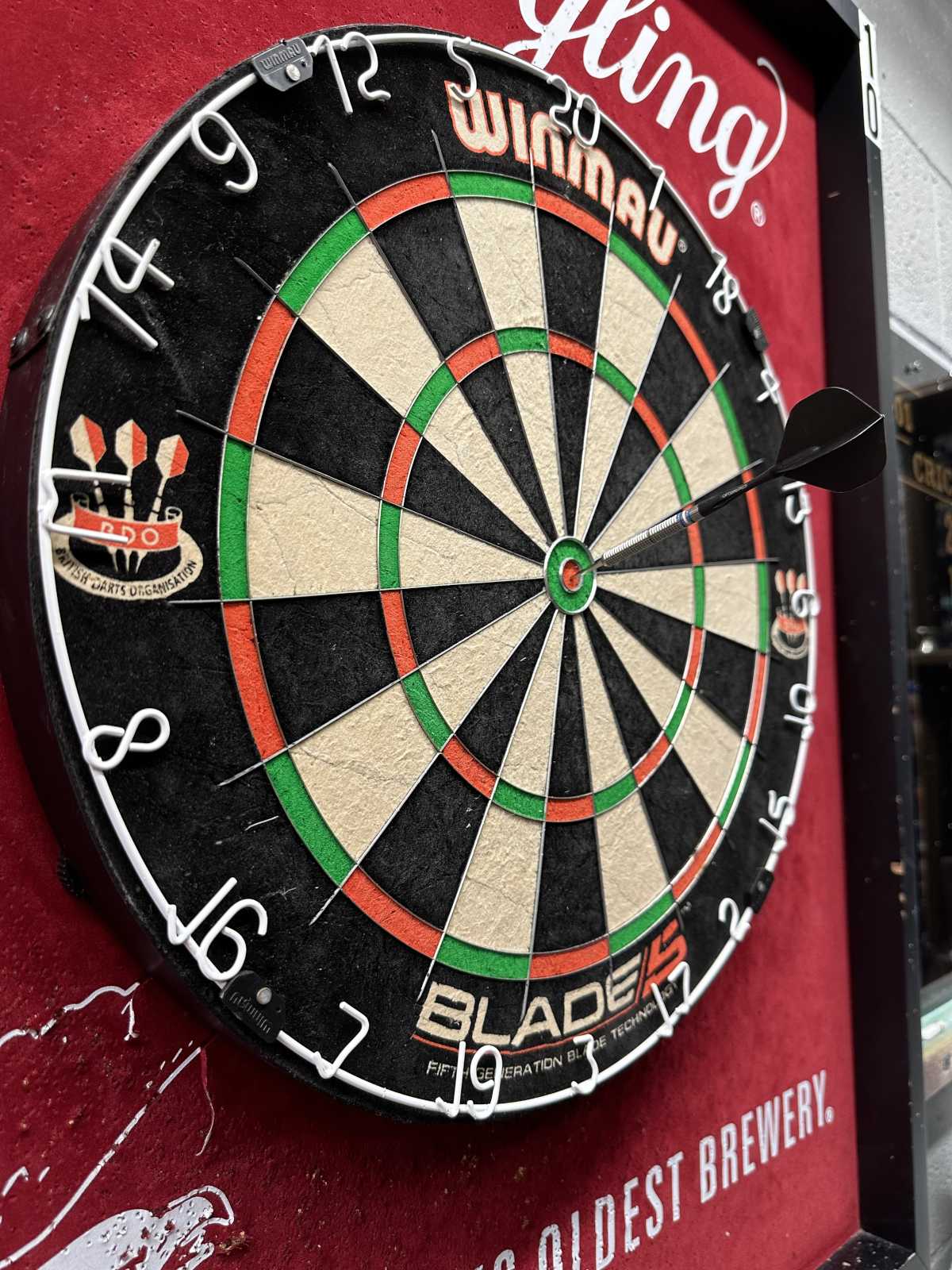 A dart board on the side of a building.