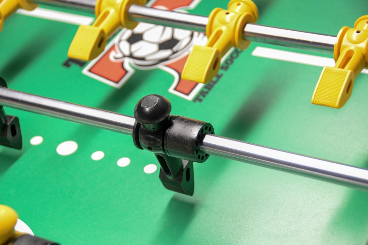 A close up image of a foosball table.