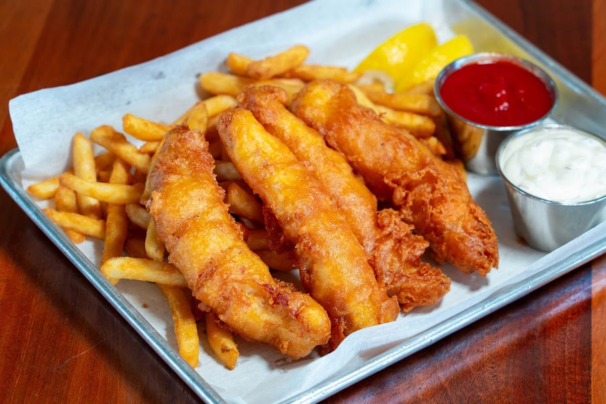 Fish and chips served with dipping sauces