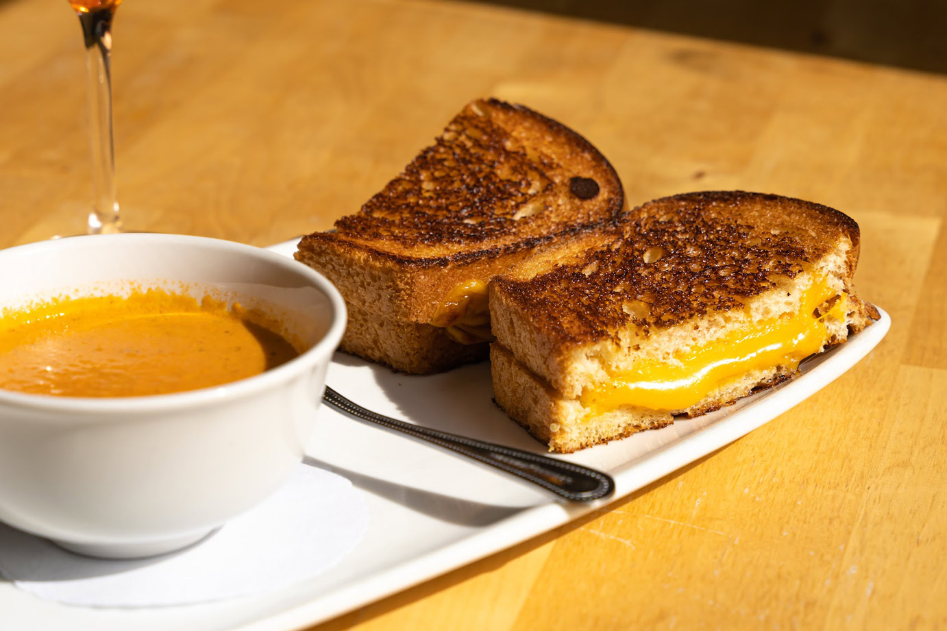 Grilled cheese sandwich with a soup on the side