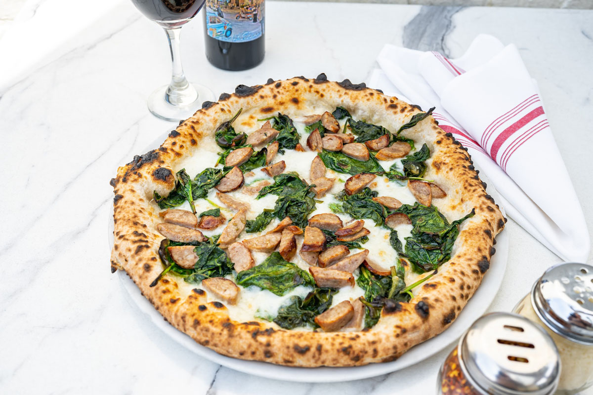 Sausage pizza, with cheese and spinach