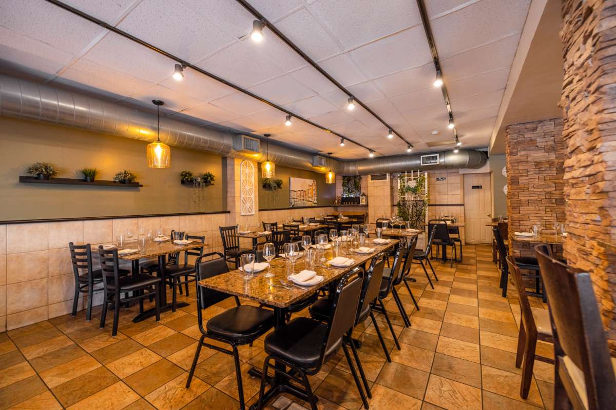 Interior, joined tables set for dining