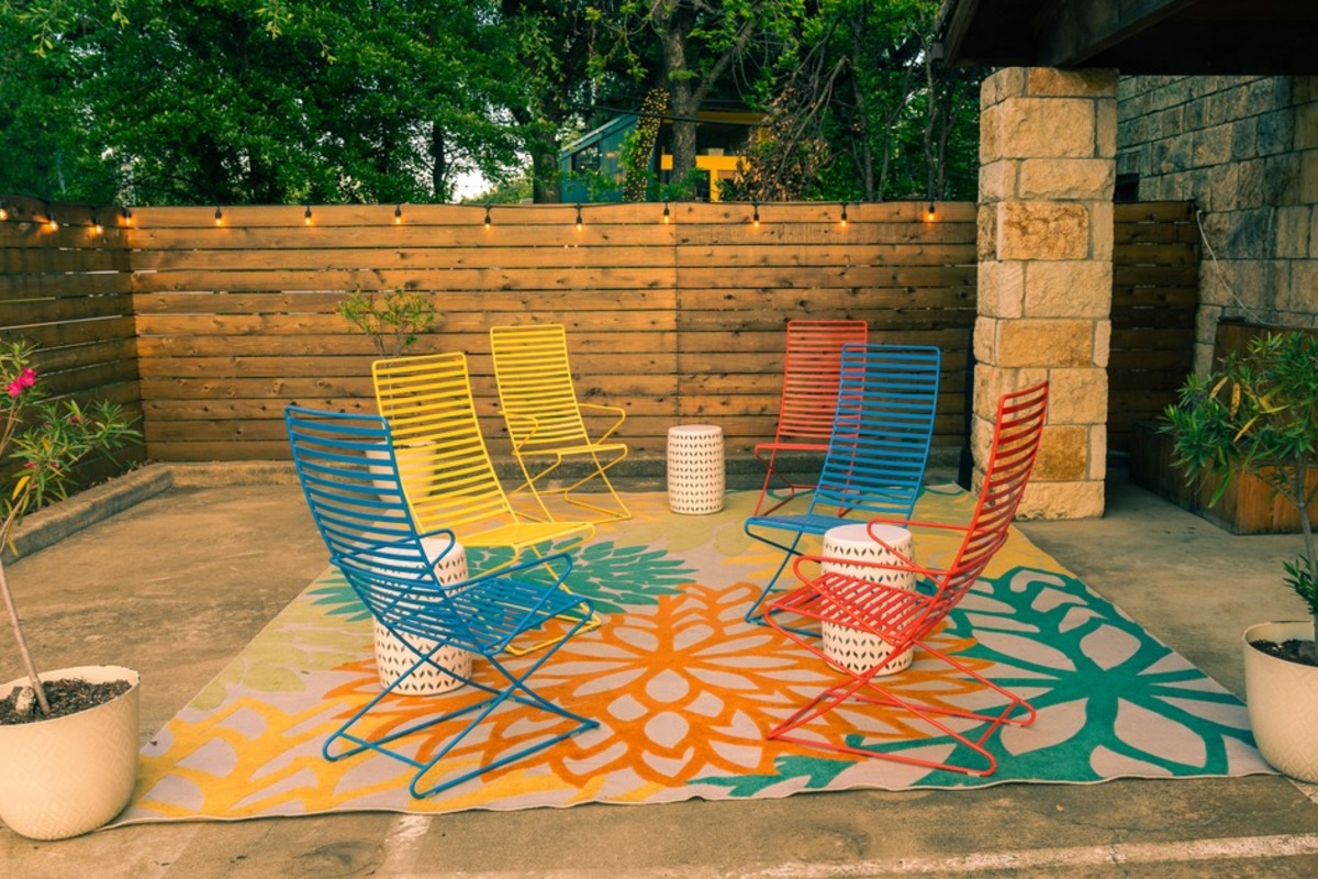 Colorful patio chairs in the private courtyard.