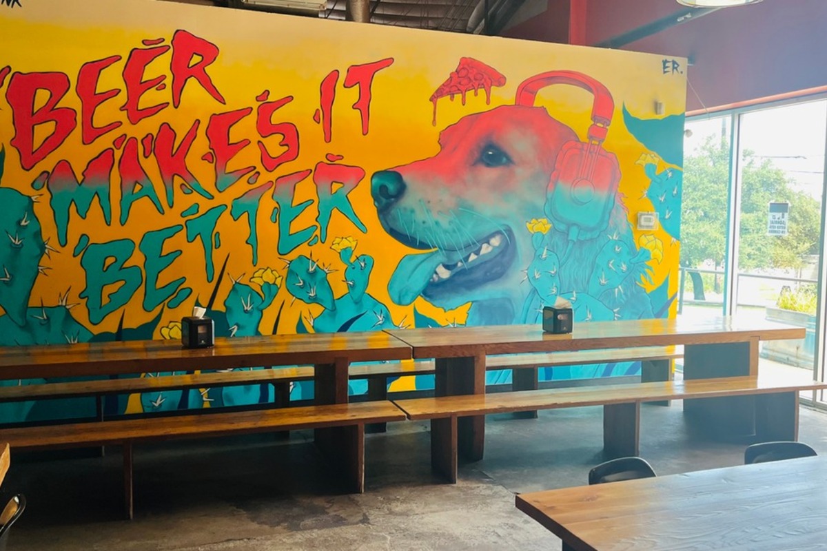 Mural and communal bench seating in The Lounge.