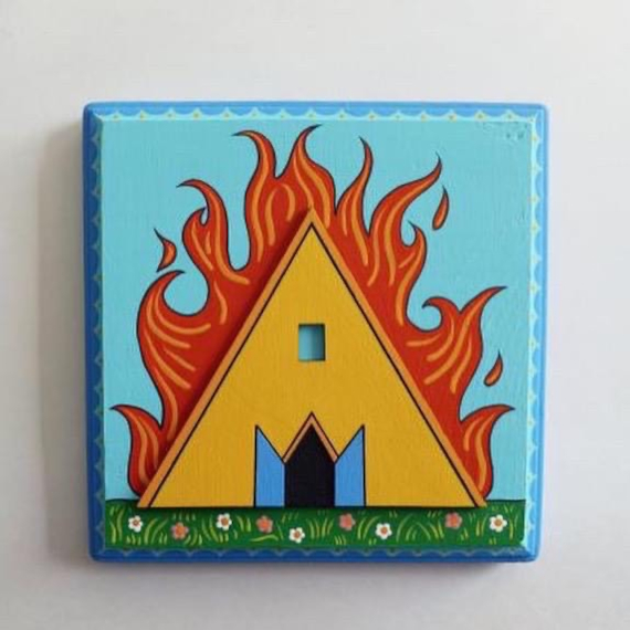 A square painting of a triangle with flames on it