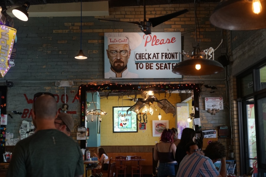 Bouldin Creek Cafe's interior is covered with art, posters and stickers.