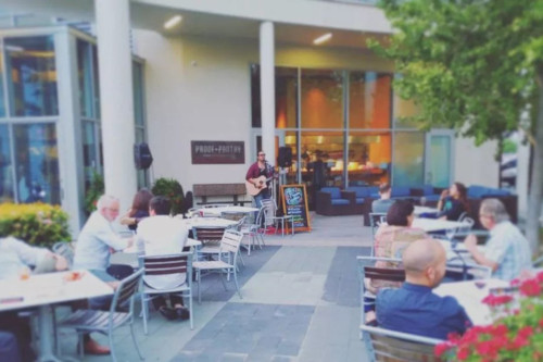 Guests enjoying live music in one of the bar's patios