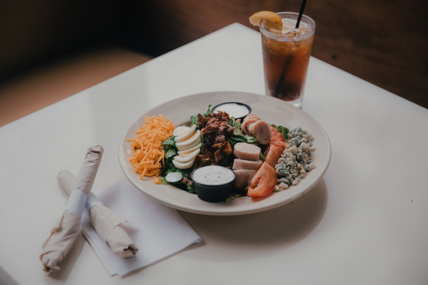 Smoked meat, two dips, fries and vegetables, boiled eggs
