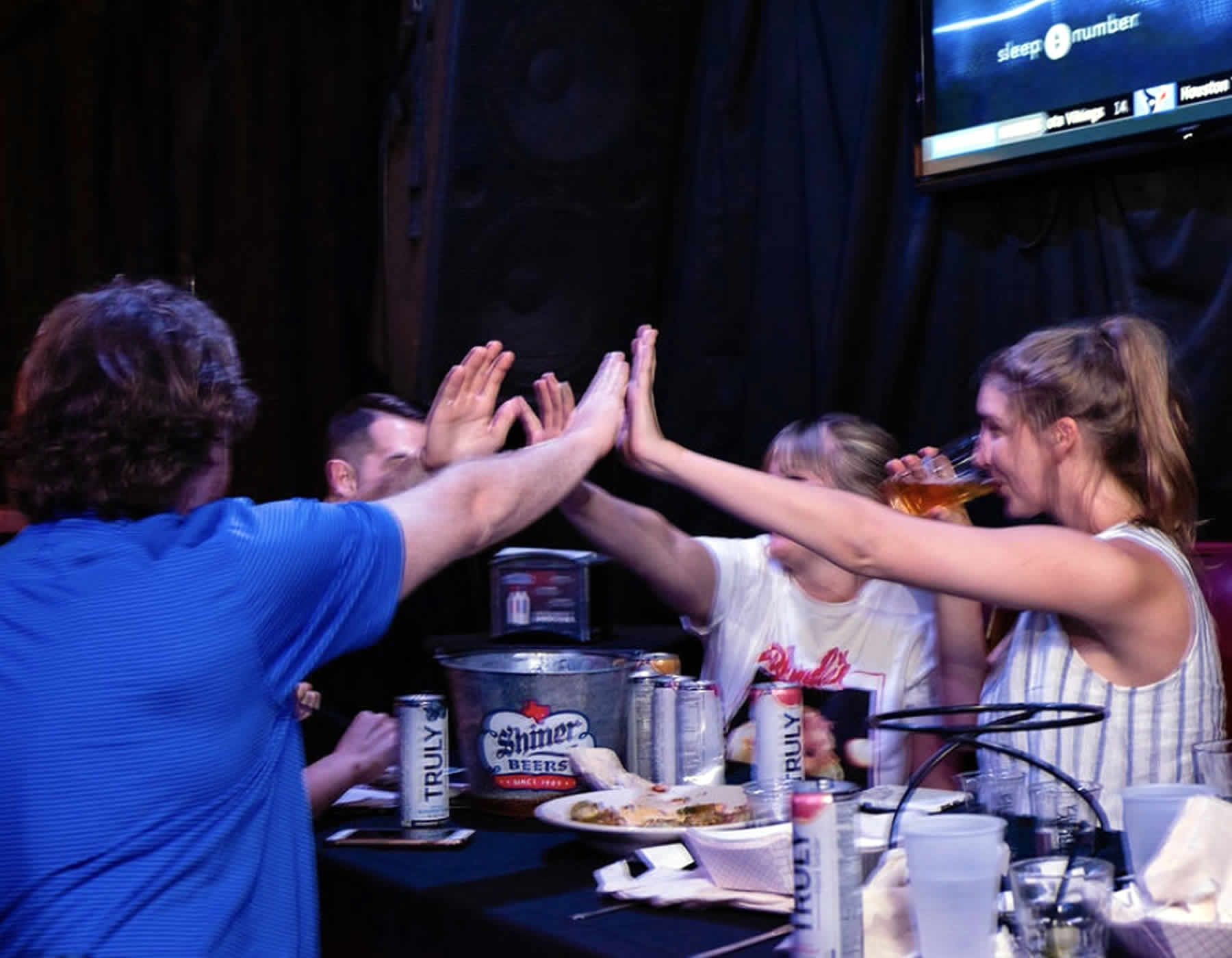 guest drinking and cheering