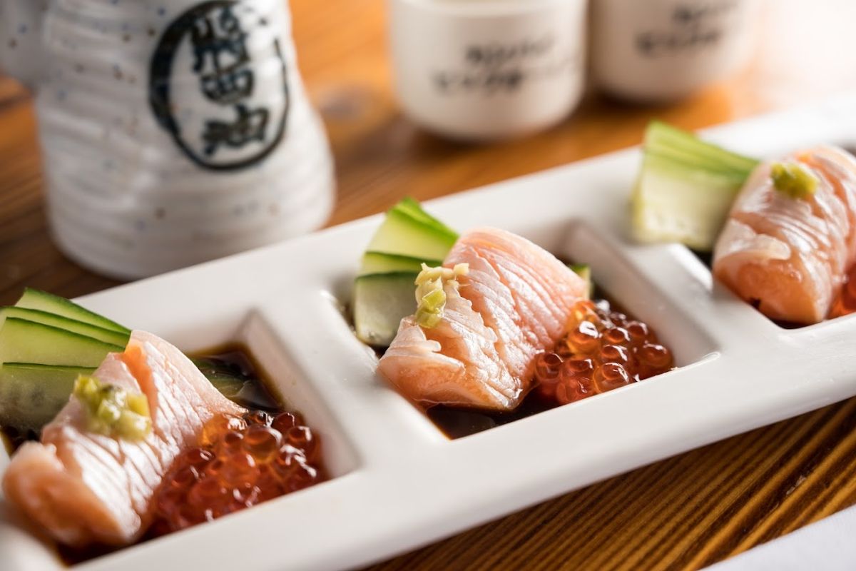 Closeup of a sushi dish with salmon, cucumbers and caviar 