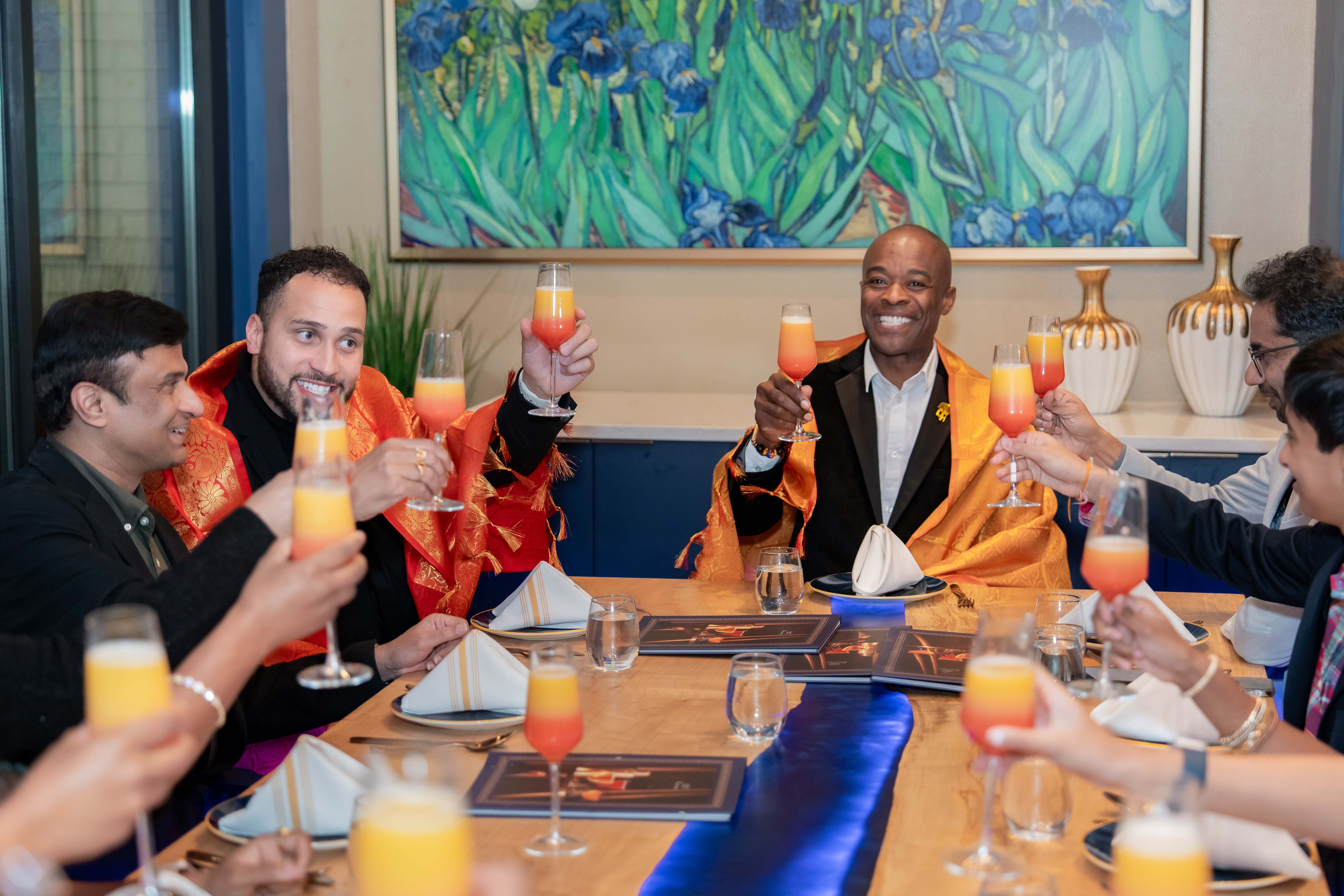 Coworkers toasting glasses at a corporate event