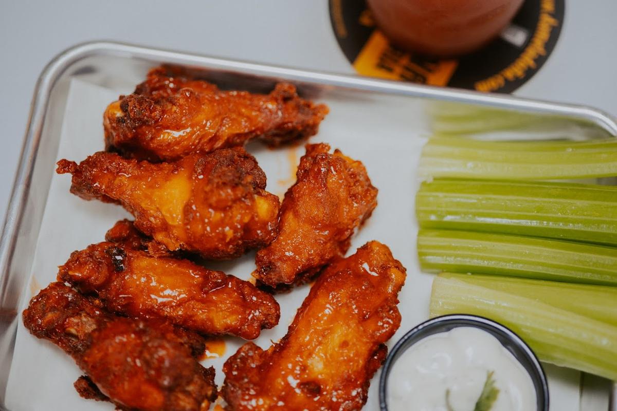 Chicken wings with celery sticks and dipping