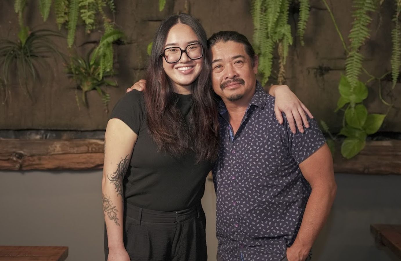 two people huging and simling