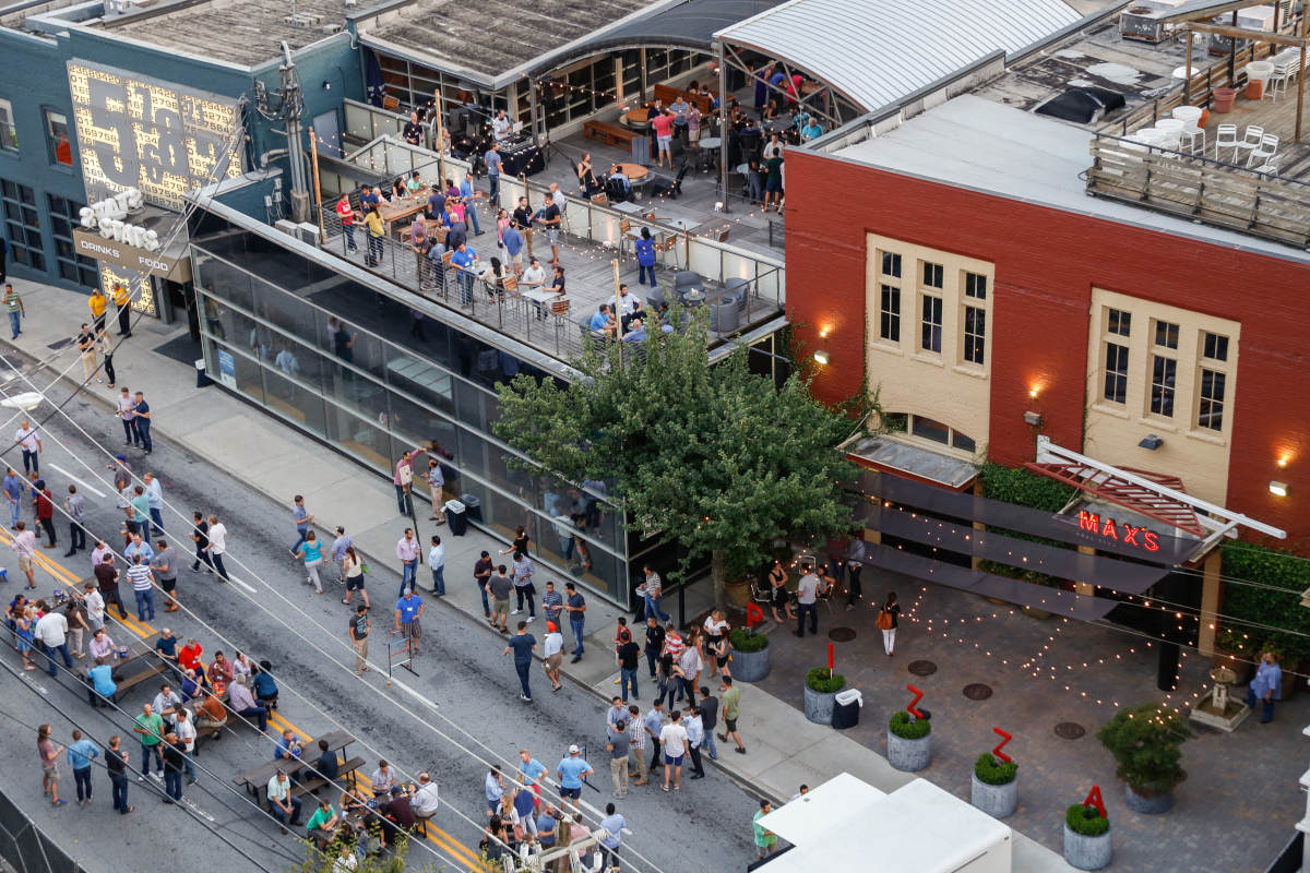 Pubs exterior, view from above,guests sitting, drinking