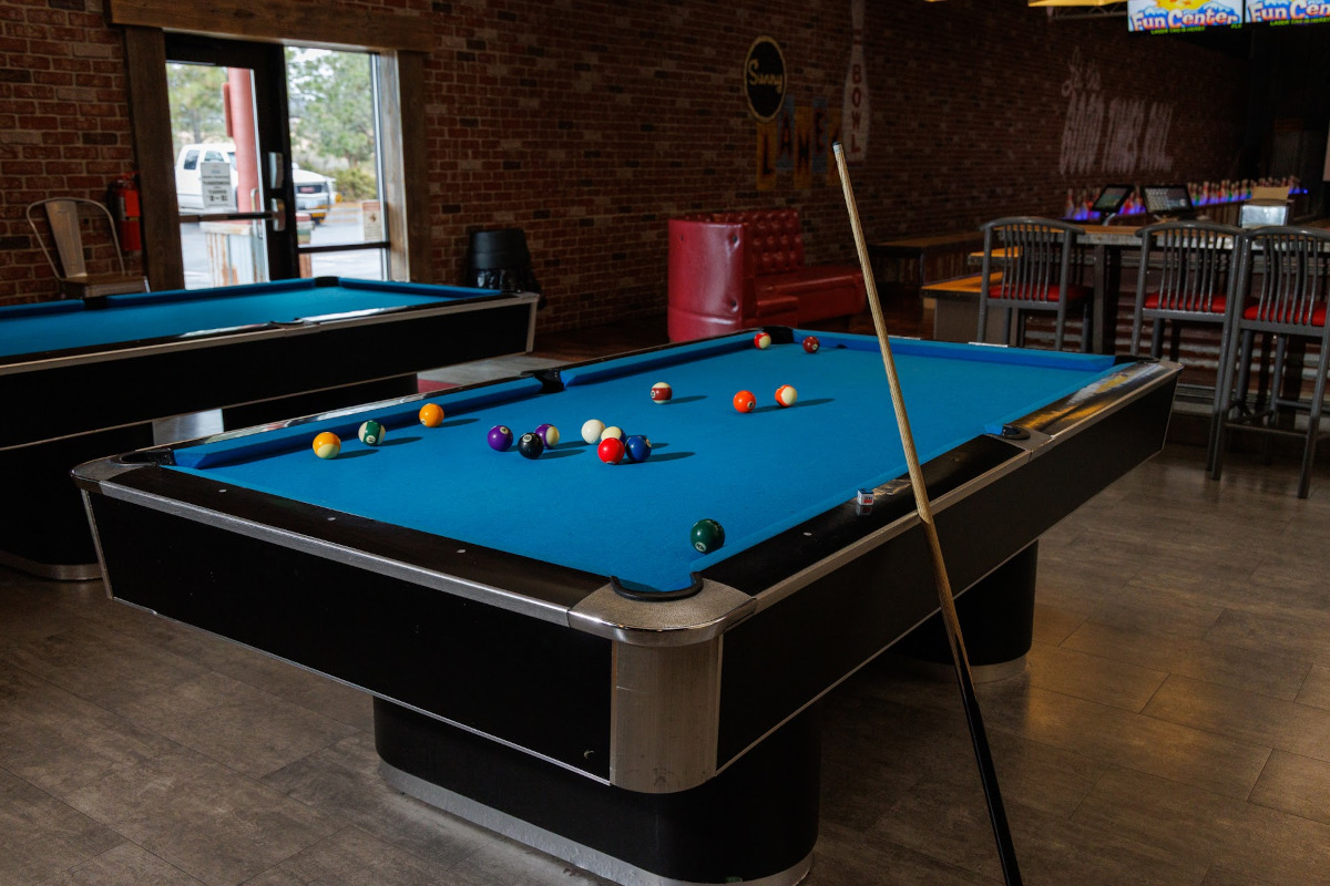 Billiards table with the balls scattered on the table