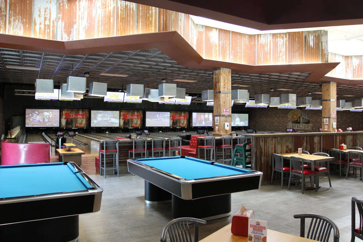 Tables for billiards and bowling alleys in the background