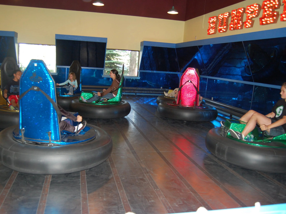 Kids driving bumper cars in the arena