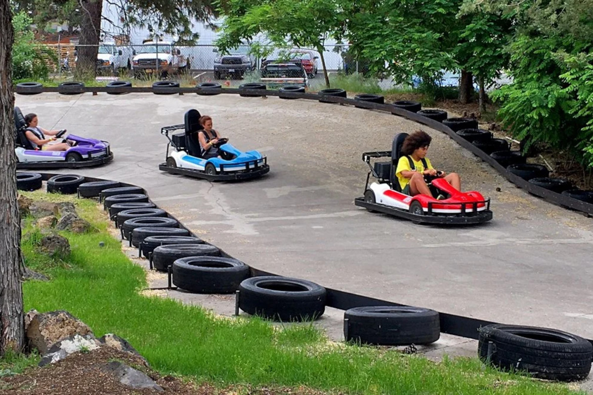 People driving carts at the track