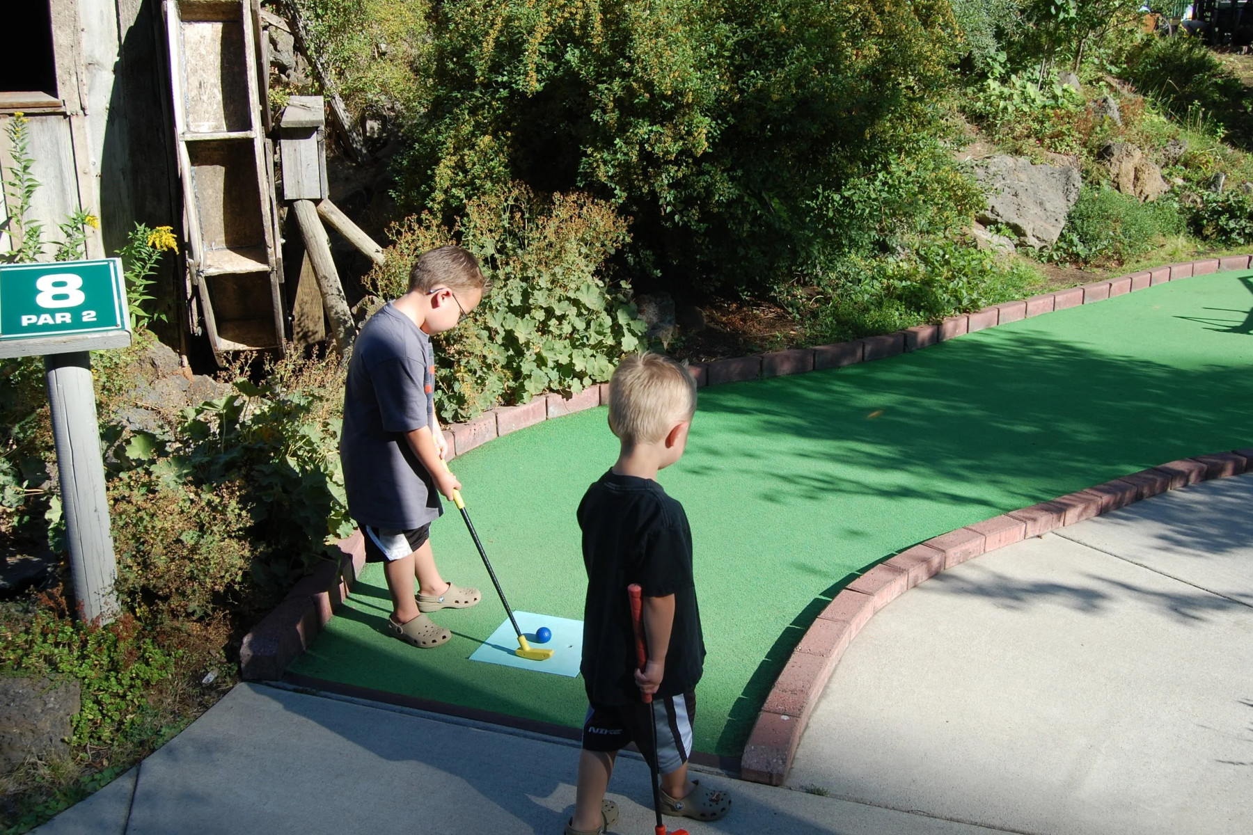 Children playing mini golf
