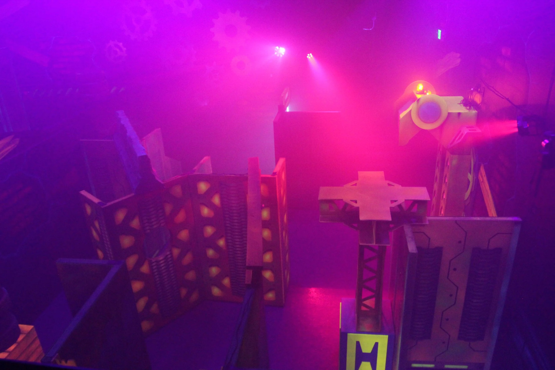 Laser tag space with various obstacles and neon lights