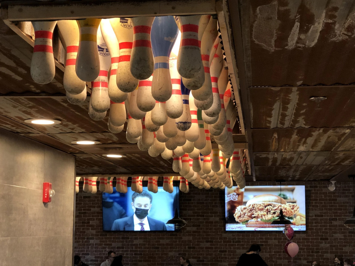 The lighting above the bar made of upside-down bowling pins