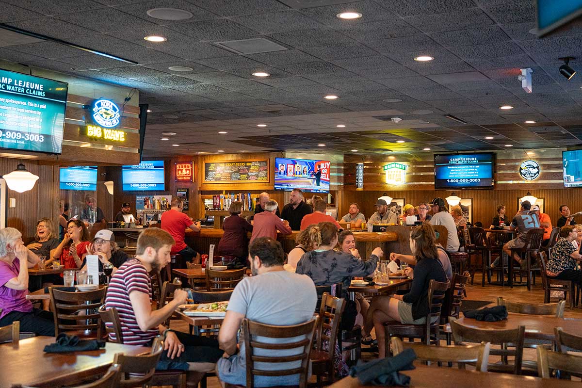 Interior, lots of people sitting at tables and eating