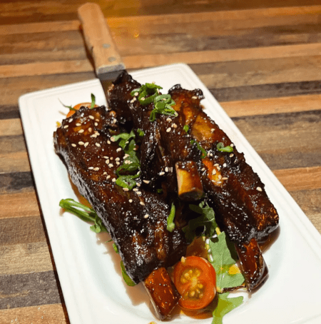 a plate of ribs  at daughter thai kitchen & bar