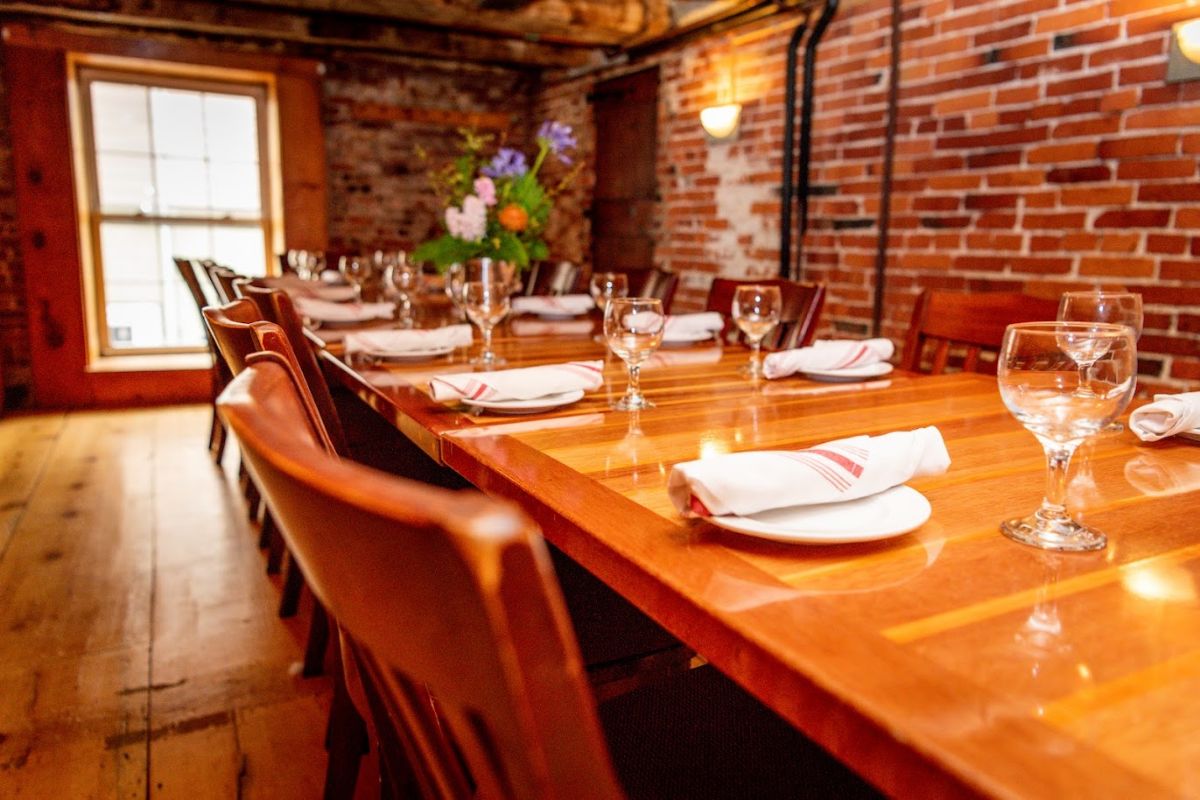 Interior, lined up dining tables with tableware