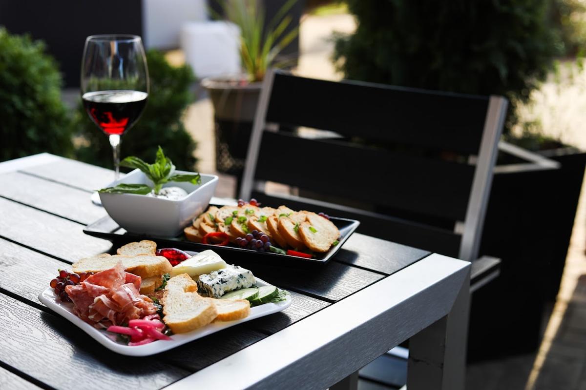 Small plates outside with wine