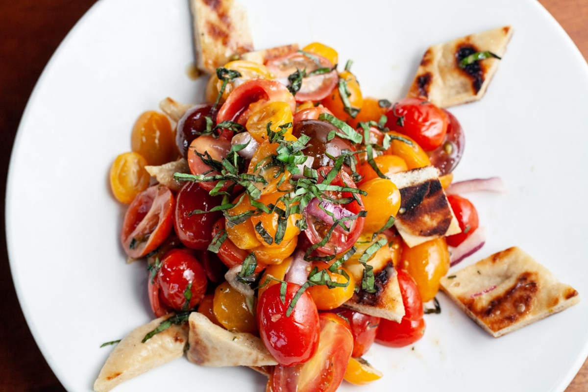 Toast salad with cherry tomato and parsley on top
