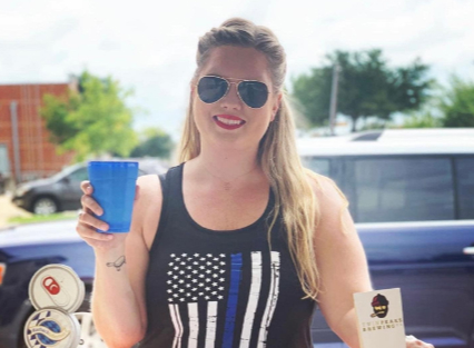 Guest enjoying a drink at the TPCA fundraiser