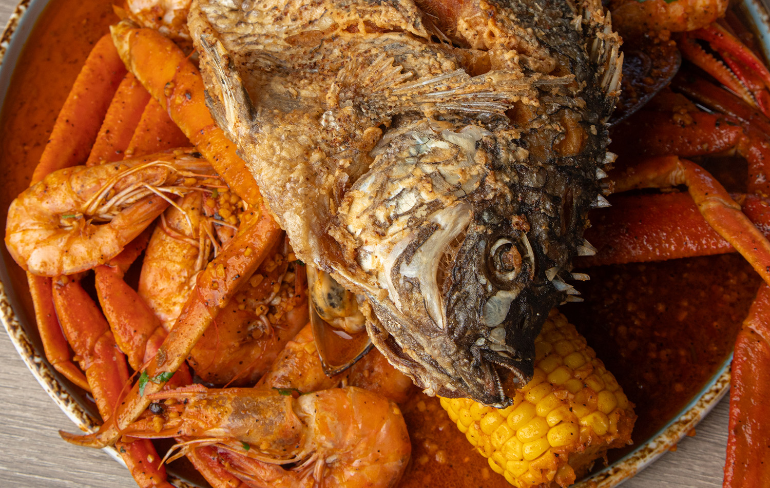 A whole red fish with corn top view 
