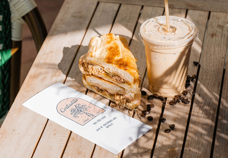 Milkshake and part of a sandwich