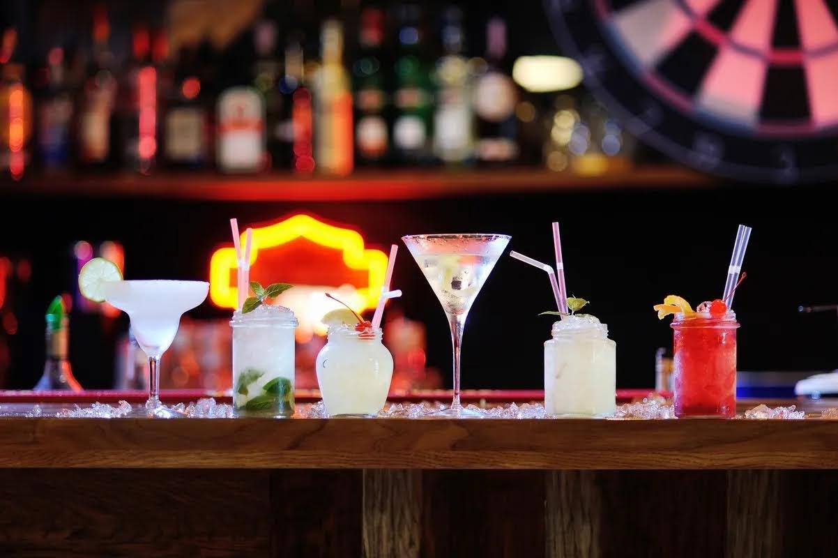 Assorted cocktail drinks served on the bar counter