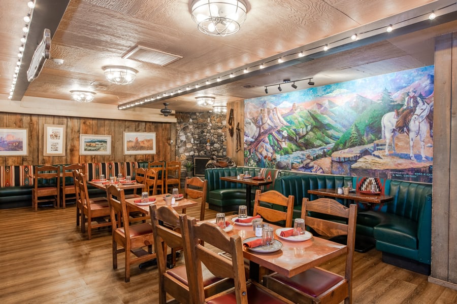 restaurant interior with a large picture on the wall