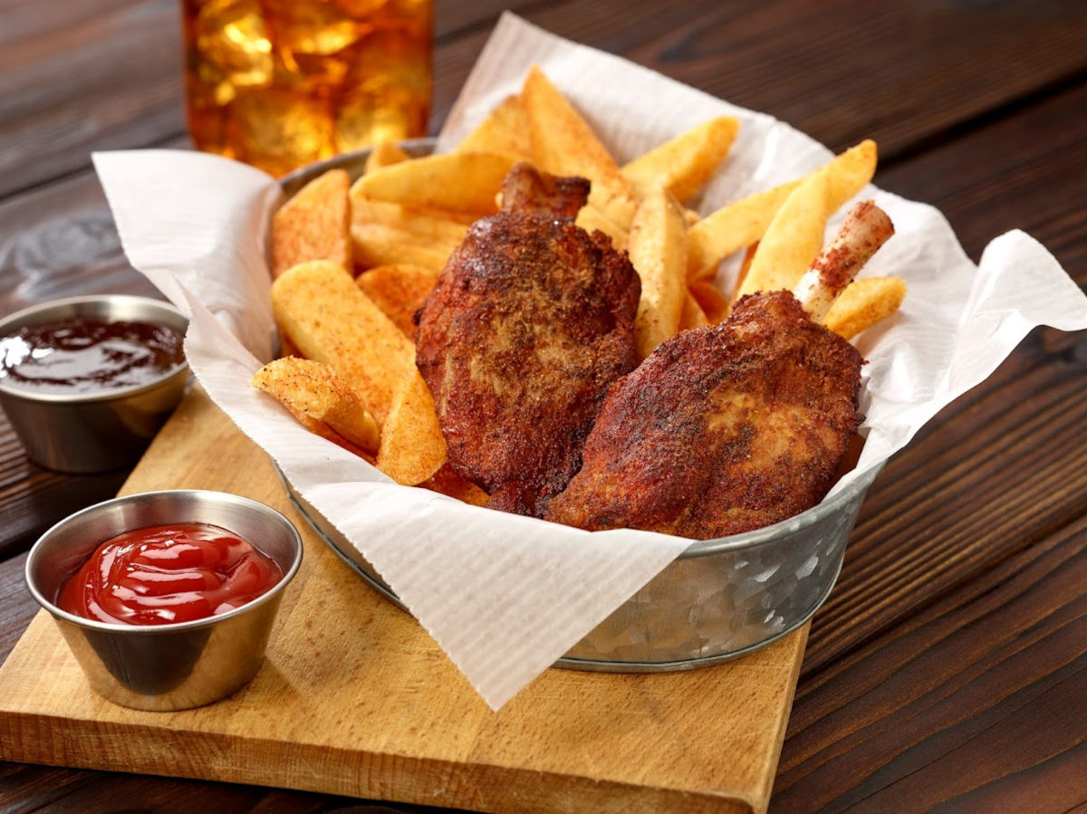 Grilled chicken, snacks and red dip on the side