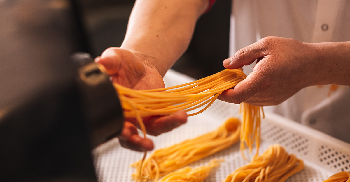 Spaghetti being made
